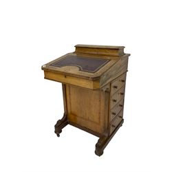 Victorian inlaid walnut davenport desk, raised compartment over sloped hinged top with red leather inset decorated with gilt Greek key design, fitted with four drawers and opposing false drawers, on compressed bun feet with brass and ceramic castors