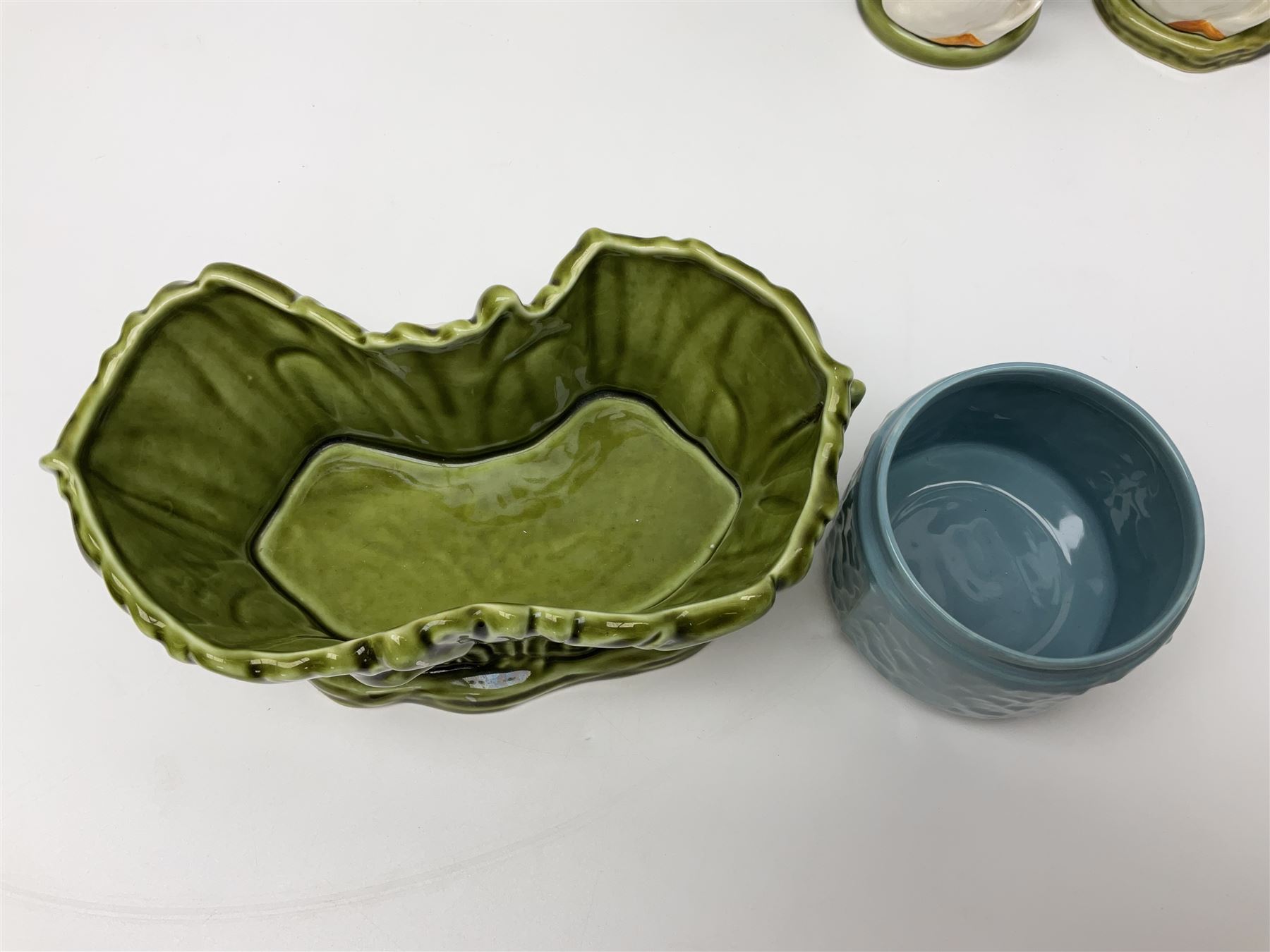 Sylvac budgieregar wall pocket, together with other Sylvac cermics including swan vases, blue tit vase and a frog figure etc, all with printed or impressed marks beneath, and a Poole Pottery cat figure, with printed mark beneath, wall pocket H22cm