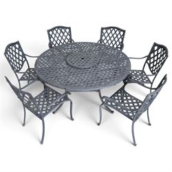 Grey-painted cast metal garden dining suite, comprising circular latticework table on splayed supports (W152cm H72cm), and six matching open armchairs with lattice backs and seats (W61cm H93cm)