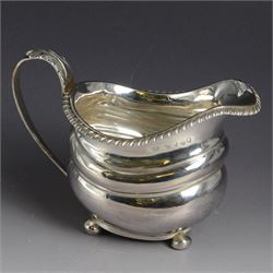 George III silver milk jug, of oval form with oblique gadrooned rim and acanthus leaf capp...