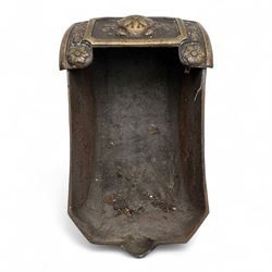 Late 19th century Victorian cast iron and brass purdonium, domed lid with central embossed sunflower and foliage panel within a floral border, flanked by scrolled and foliate detail, raised on shaped feet