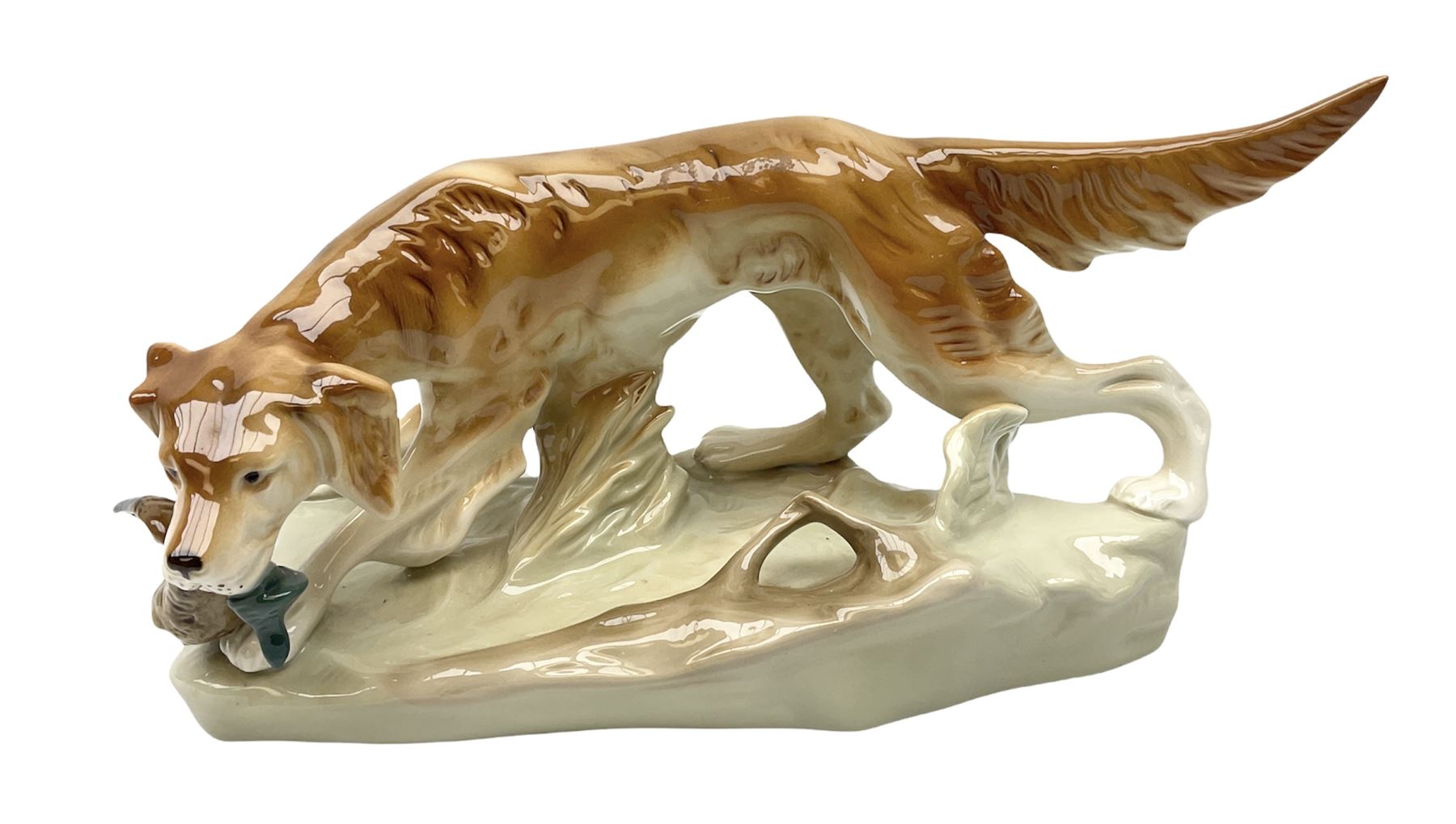 Royal Dux porcelain hunting dog with a bird, printed mark beneath, L36cm