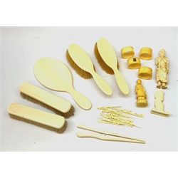 A selection of assorted ivory and bone items, to include a Japanese okimono modelled as a sage, four napkin rings, three with hallmarked silver cartouches, a early 20th century dressing table set, comprising hand held mirror, two hair brushes, two clothes brushes, and glove stretchers, plus a number of picks with carved figural terminals. 