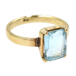 Gold single stone emerald cut aquamarine ring, stamped 18K