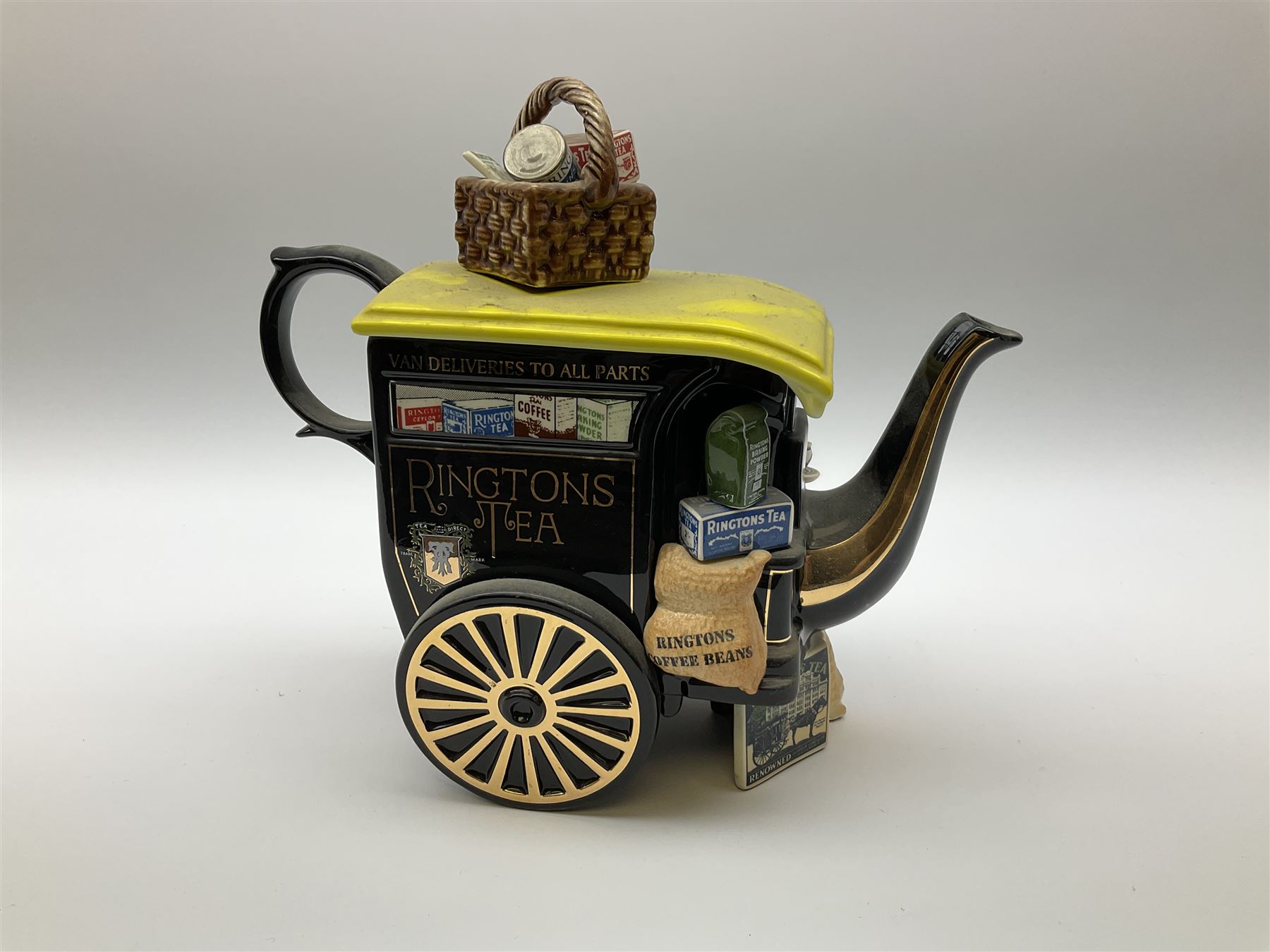Three Ringtons novelty teapots, comprising The Ringtons Van teapot, the Tea Merchant teapot, and Millenium Celebration teapot. 