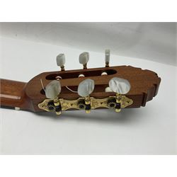 British hand made classical acoustic guitar by Huw Morgan with Indian rosewood back and sides and spruce top; bears label dated May 1998; L100cm; in Tribal Planet lightweight carrying case