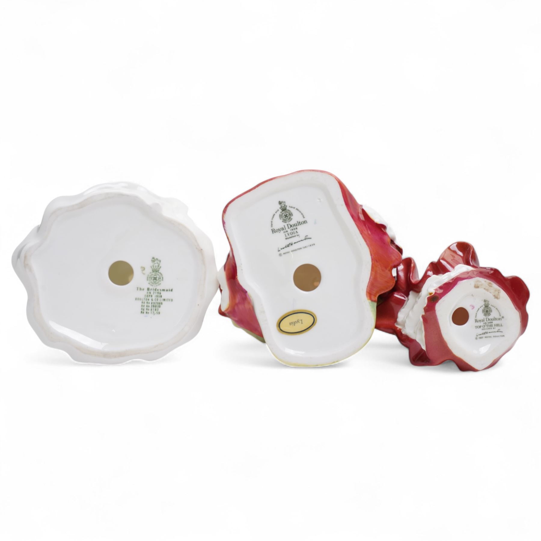 Eleven Royal Doulton figures, including Miss Demure HN1402, Ninette HN4717, Janet HN1537, Embrace HN4258 etc 