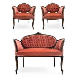 Edwardian inlaid rosewood parlour suite, comprising pair of tub shaped armchairs (W77cm, D69cm, H88cm); and matching two-seat sofa (W112cm, D69cm, H88cm), each with carved crest rails with shell motifs, deep button-tufted oval backs upholstered in pink fabric with braid trim, on cabriole supports