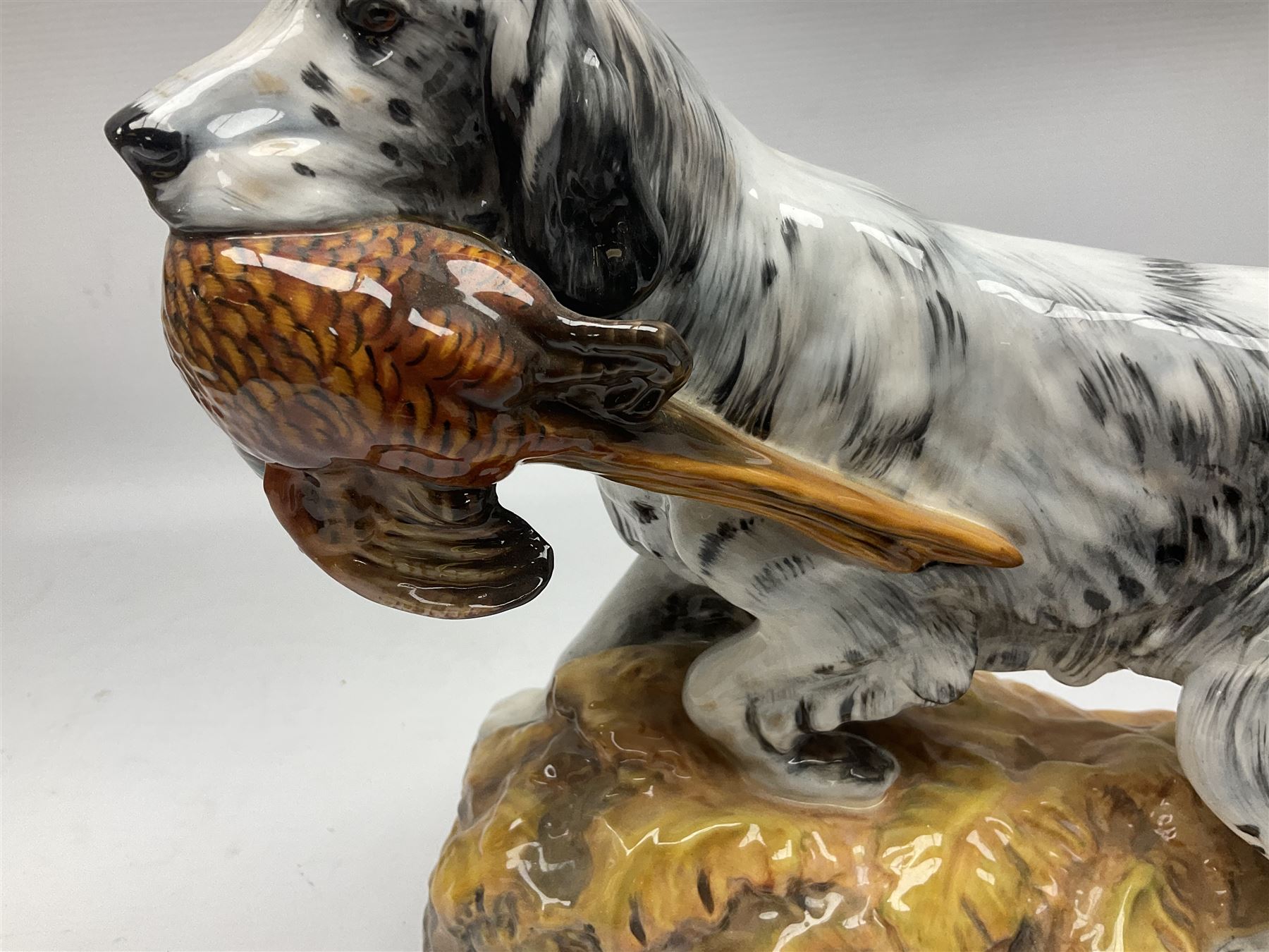 Royal Doulton model of an English setter carrying a pheasant, HN 2529, designed by Frederick Daws, H21cm