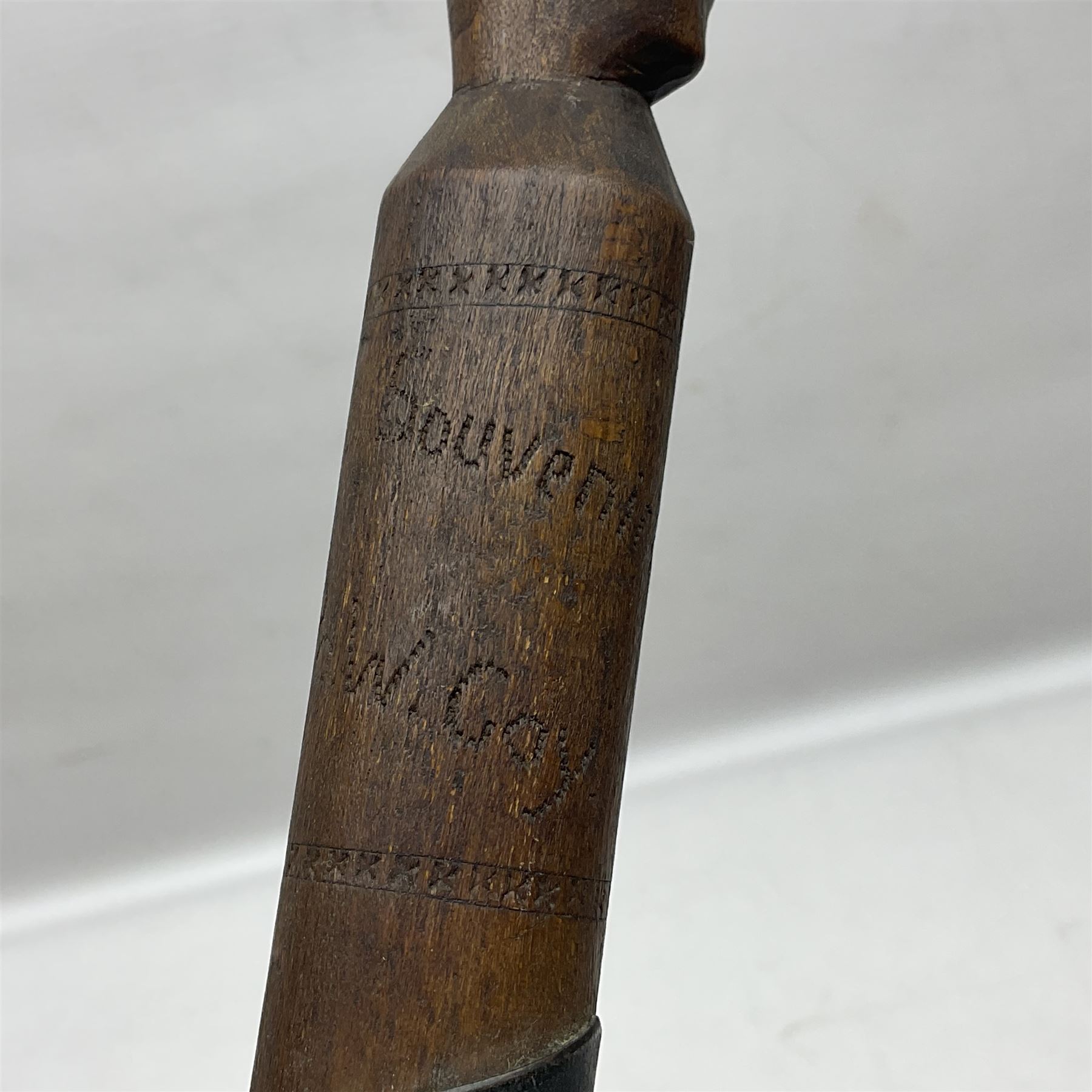 WW1 Prisoner of War carved beech walking cane, the terminal as a head wearing a helmet, and inscribed 'Souvenir from 370th PoW Coy Menin 1919'; bears metal plaque with indistinct monogram L91cm