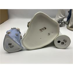 Eleven Nao figures to include Cowboy, Girl with Puppy, Clown, Girl in hat etc 