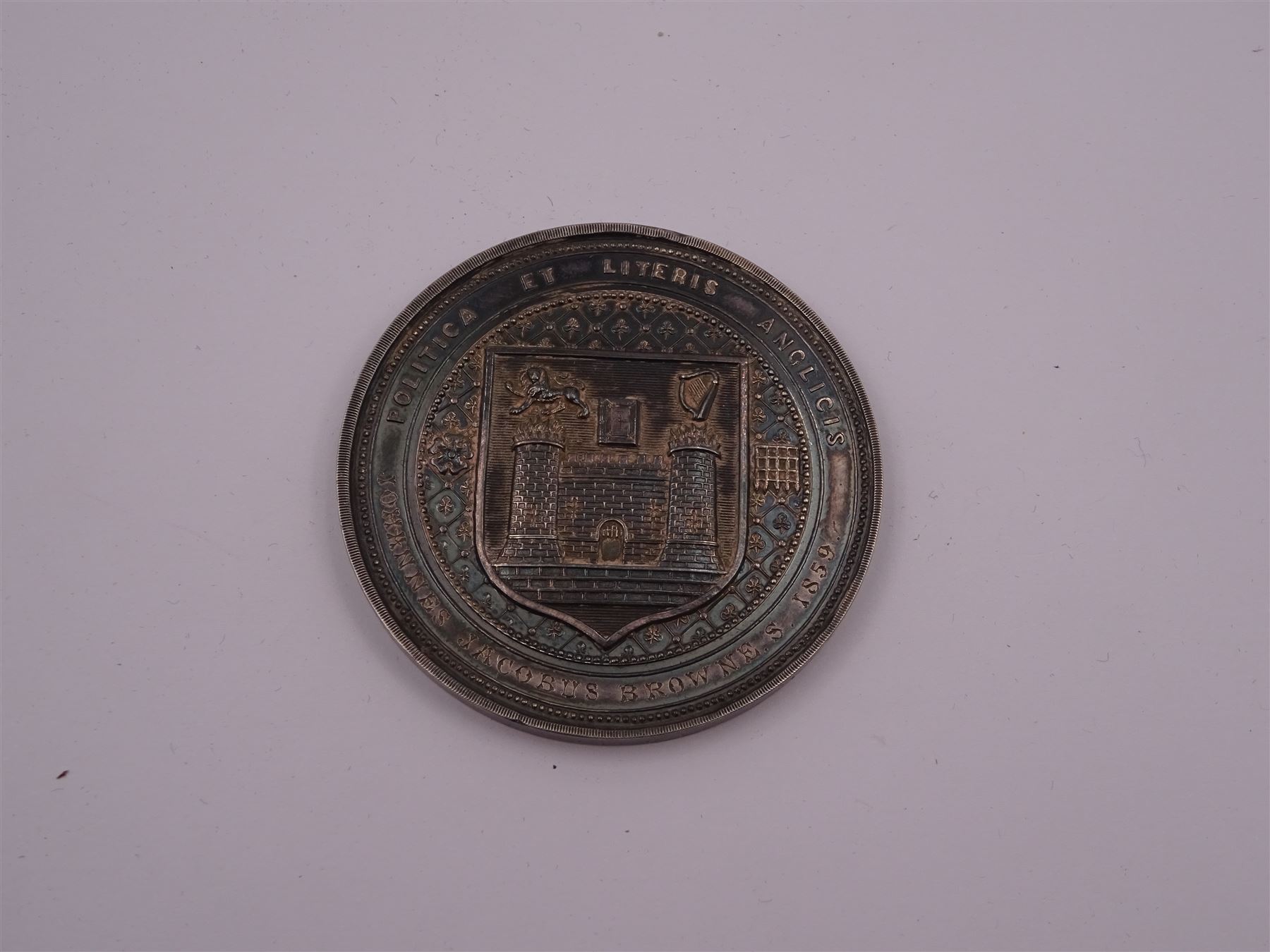 Victorian Trinity College Dublin silver medal, depicting bust of Elizabeth I, with arms of the college verso, awarded to Johannes Jacobus Browne S 1859,  Politica Et Literus Anglicis, in tooled leather fitted case with gilt detailing