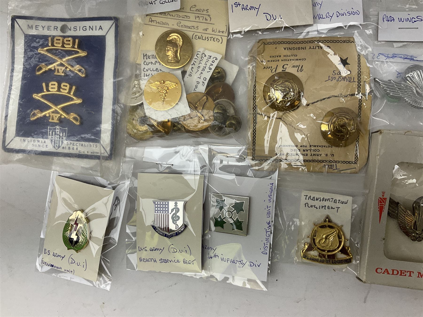 American patches and badges, including para wings, USS Constellation, Strategic Air Command, U.S. military academy, health service regt, Navy Seals, Air Defence Command, Seventh Fleet, various collar badges etc