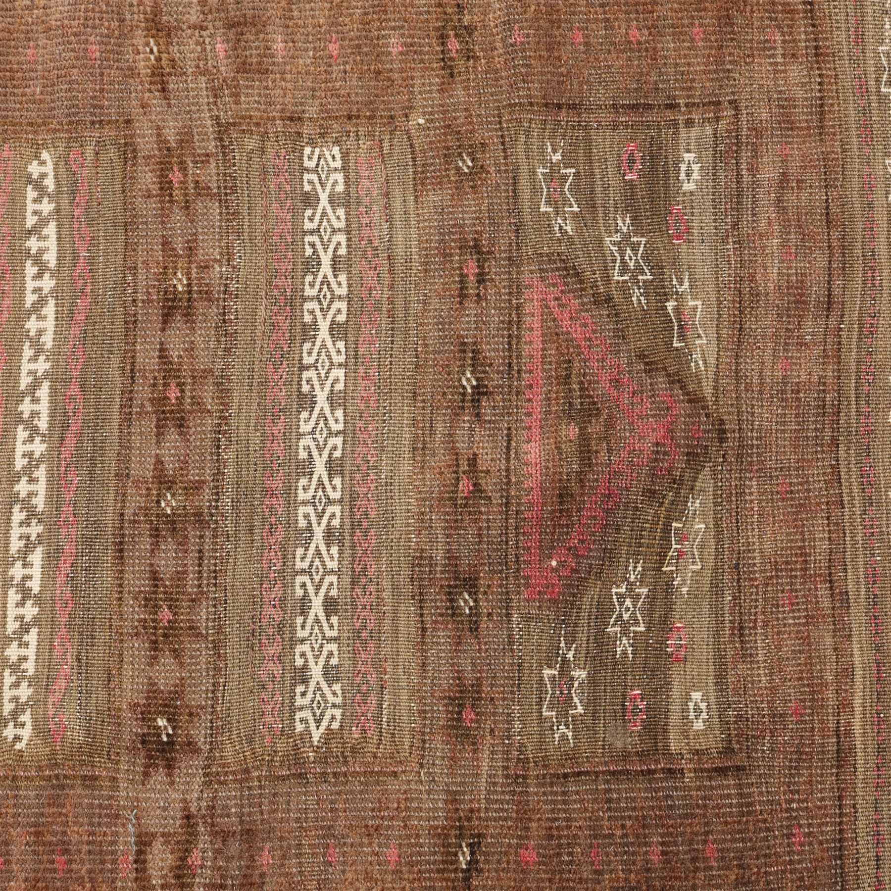 Tekke Turkman rug, madder red field decorated with repeating rows of octagonal guls, framed by multiple geometric borders, 86x133cm and an Anatolian flatweave kilim, 95x140cm, (2)