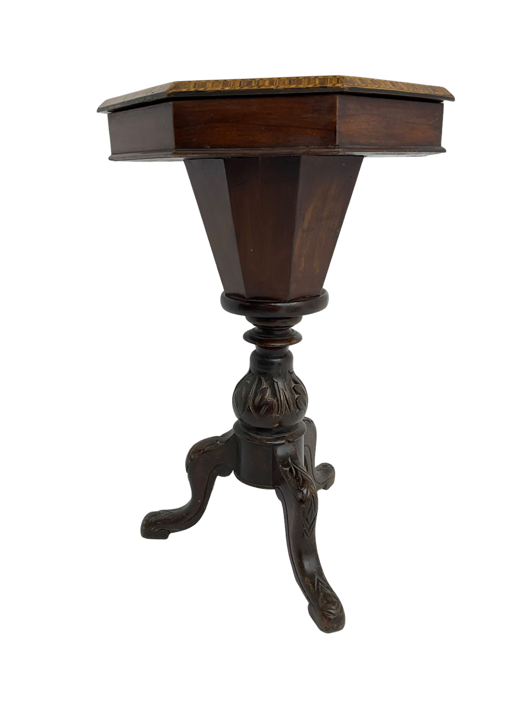 Late 19th century inlaid walnut sewing or work table, octagonal hinged top with satinwood and ebony chessboard inlay, surrounded by foliate decoration, the edges inlaid with crossbanding and stringing, fitted interior with chess pieces, raised on baluster pedestal carved with acanthus leaves on a tripod base 