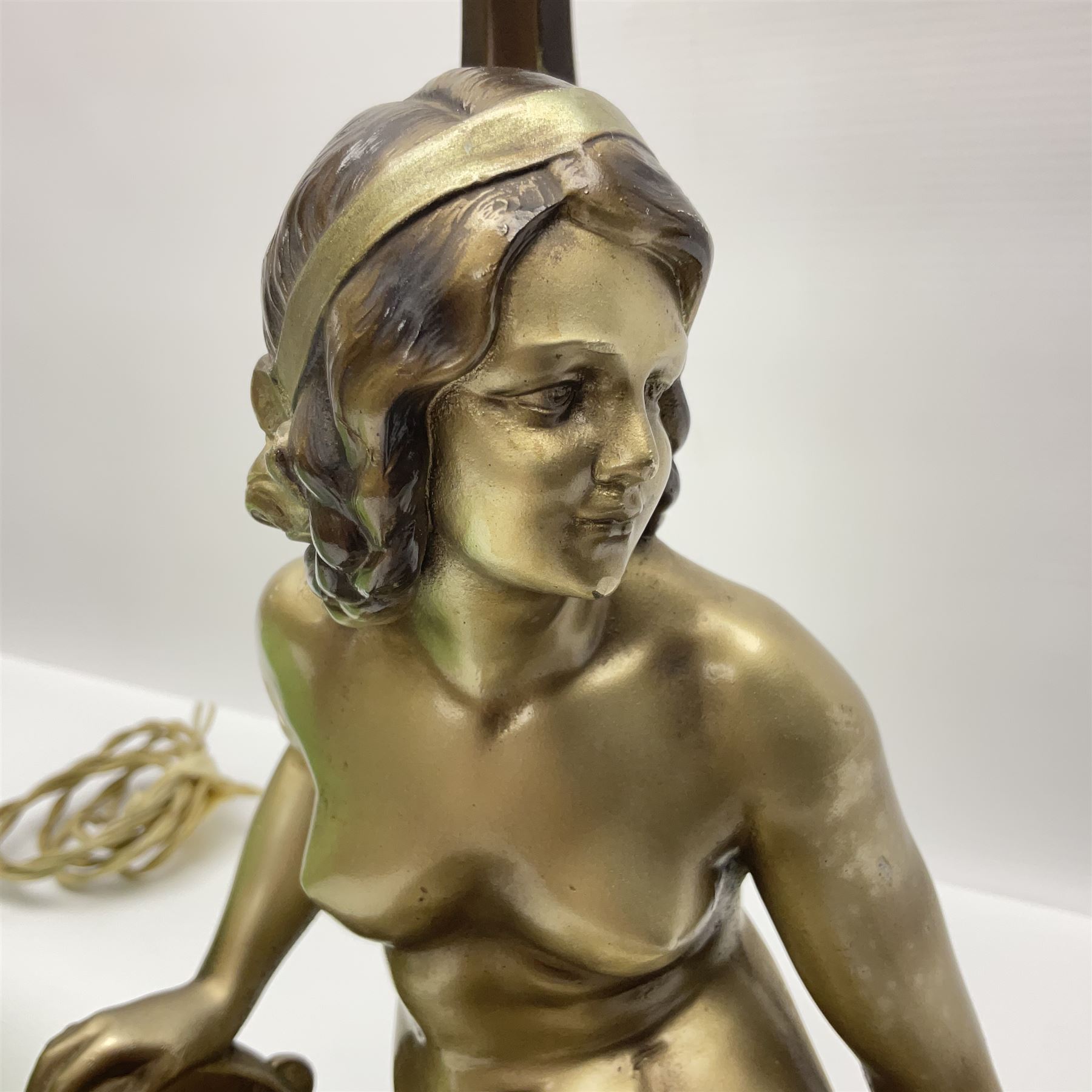 Art Deco style bronzed and gilded spelter figural table lamp with green Uranium glass shade; H48cm, another table lamp; and a bisque group