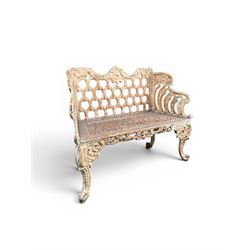 Victorian revival Carron Foundry design heavy cast iron two seat garden bench, scrolled arms with pierced lattice seat, finished in antique white paint