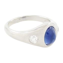 Platinum sapphire and diamond three stone ring, single cabochon sapphire of 1.65 carat, with a rubover set old cut diamond set either side, stamped 850 Plat, total diamond weight 0.42 carat