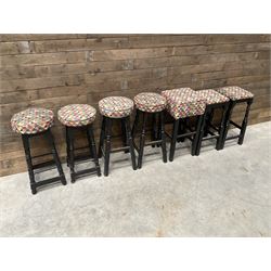 Seven tall bar stools with upholstered seat