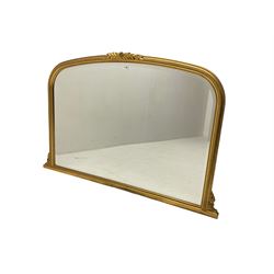 Victorian design gilt frame overmantel mirror, the arched frame topped with flower head and extending acanthus leaves, with beading along the frame, enclosing bevelled plate