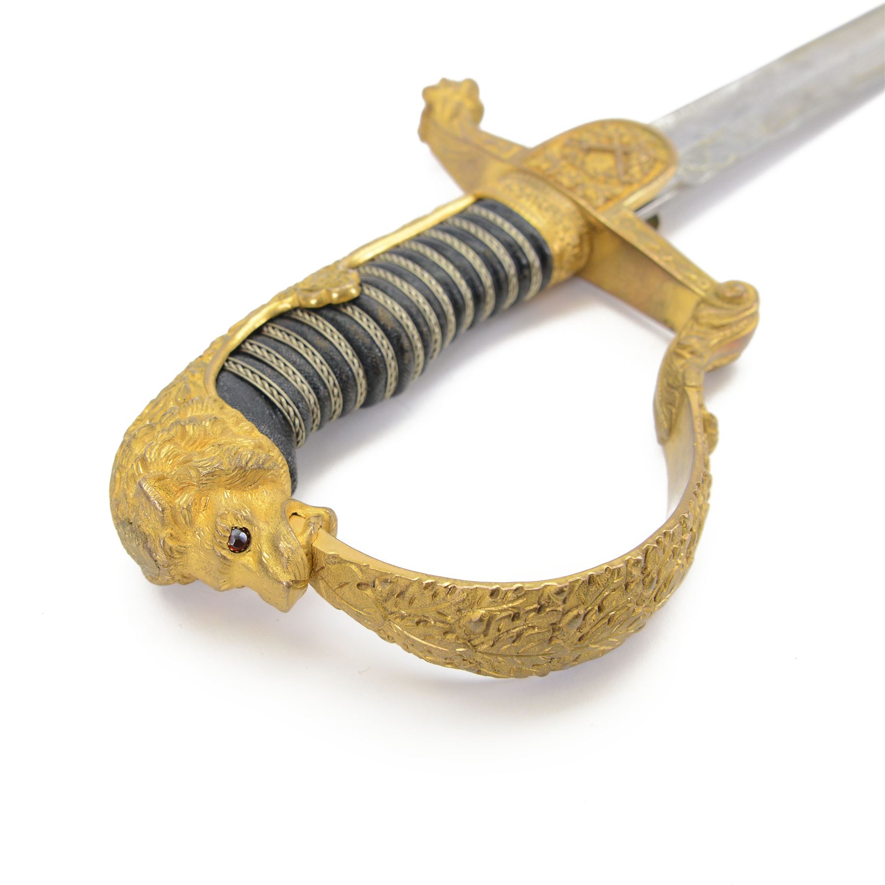 Prussian cavalry officer's sword, with 79cm etched curved blade double-edged towards the point, crossed swords insignia to langet, stirrup knuckle bow, wirebound black grip and lion's head pommel with inset ruby eyes and lion head to the quillon, in black painted steel scabbard with single suspension ring, overall L97cm