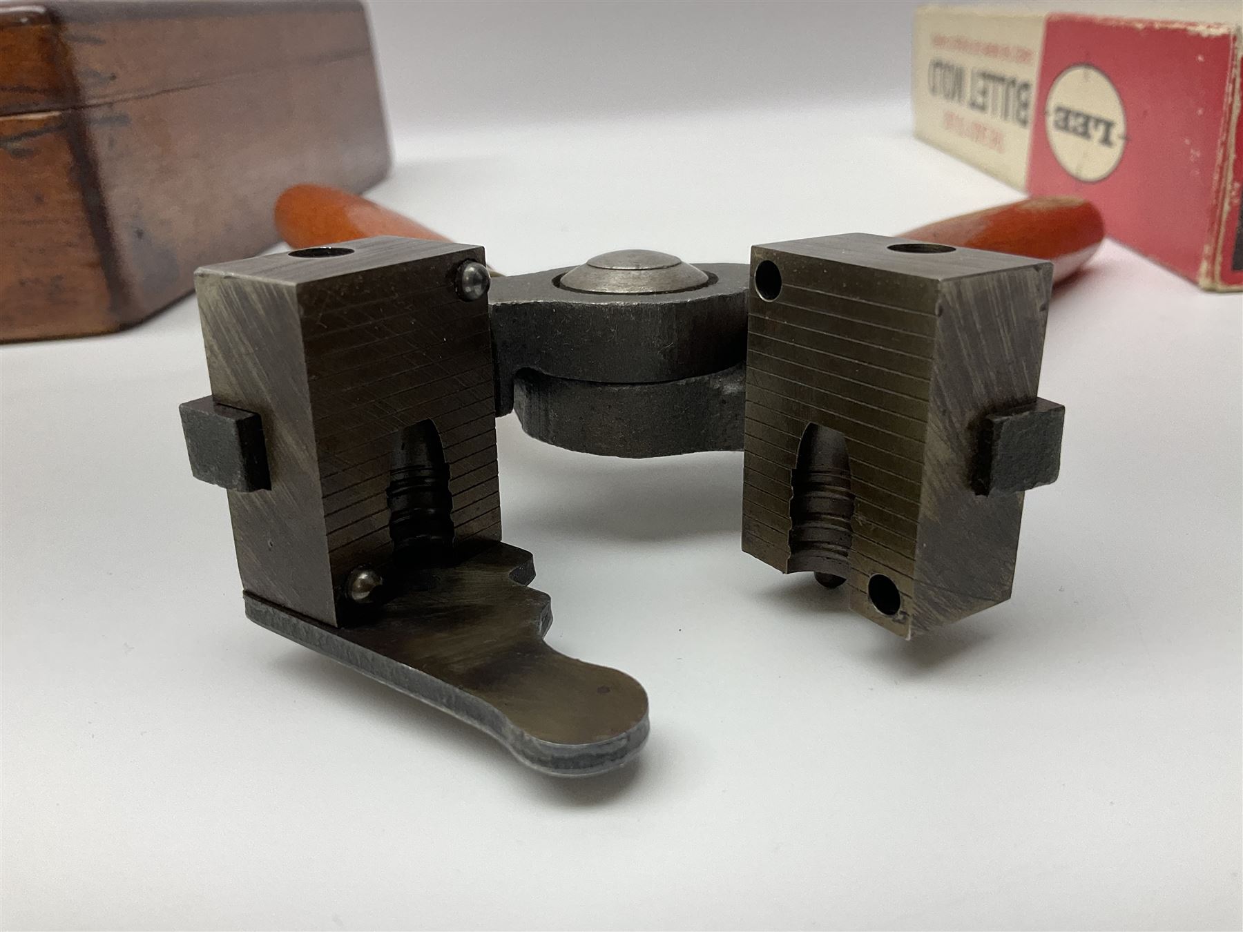 Three modern bullet moulds comprising Lee double cavity .44 calibre, boxed with instructions; and two Lyman .38 calibre; all in unrelated 19th century mahogany box