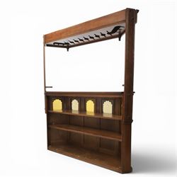 Old Charm - carved oak bar with three bar stools and associated Old Charm drinks cabinet, carved top with channels for glassware beneath, bar surface above glazed panels, shelves for glassware to the back, associated Old Charm drinks cabinet with fall front linenfold carving, above twin doors with shelved interior