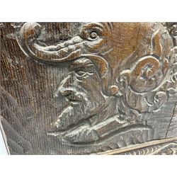 19th century Continental carved oak panel, of square form with curved upper corners, carved with the profile of a male figure facing dexter, upon a tapering base with stylised carved decoration, H51cm W54.5cm