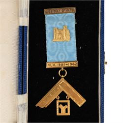 15ct gold Masonic jewel, with two gold bars on blue ribbon, bars and pendant stamped 15c, boxed