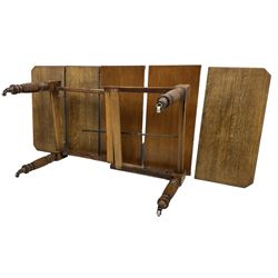 Late Victorian oak telescopic extending dining table, rectangular moulded top with canted corners, three additional leaves, on turned and reeded supports with brass and ceramic castors