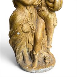 Composite garden statue group of Romeo and Juliet embracing in Medieval dress, surmounted on a naturalistic foliate base, in antique distressed glazed finish