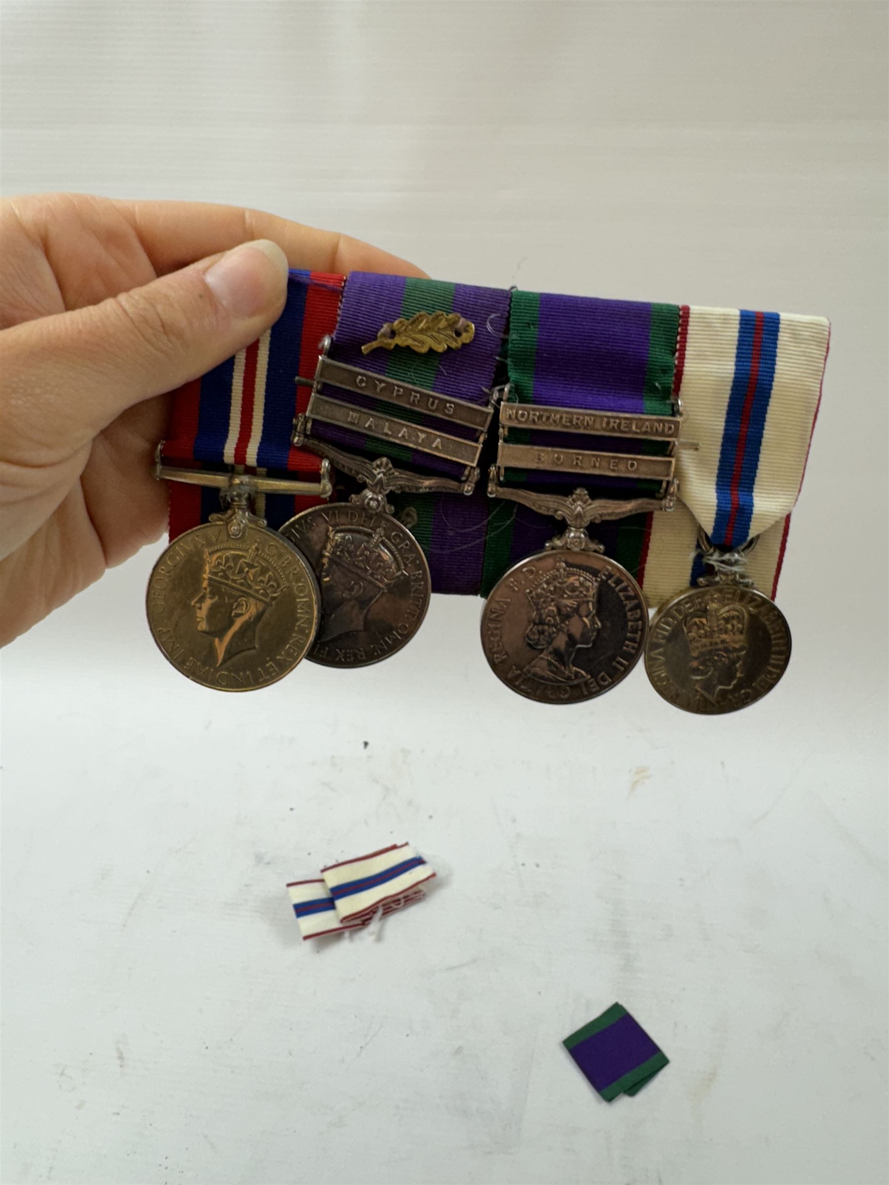 Group of four medals comprising general service medal 1918-62 with Cyprus and GVI Malaya clasps and mid oak leaf awarded to LE. P. Furse RA, general service medal 1962 with Borneo and Northers Ireland clasps awarded to major P.J Furse RA, 1939-45, war medal and ERII 1977 Jubilee medal, together with three matching group of miniatures, mid certificate and 2nd Lieutenant commission award certificate 