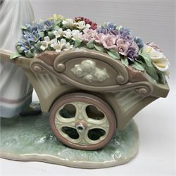 Lladro, Love’s Tender Tokens, modelled as a girl pushing a wheelbarrow full of flowers, no 6521, in original box