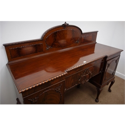  Early 20th century figured mahogany inverted break front sideboard, raised and carved back with gadroon carved detail, two cupboards with centre drawer, scroll carved cabriole legs with paw feet, W184, H158cm, D62cm  