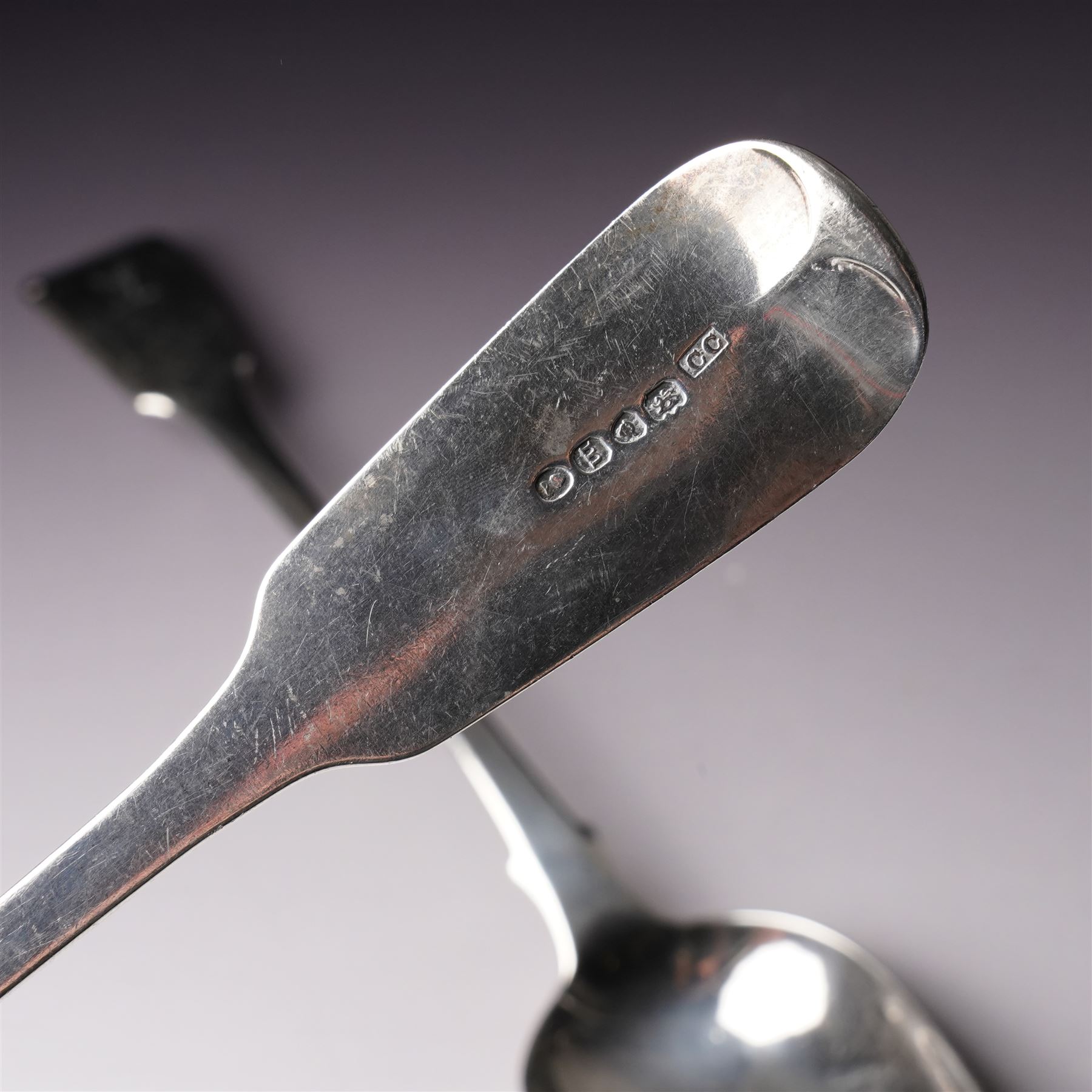  George IV silver fiddle pattern basting spoon engraved with monogram London 1827 Maker Clement Cheese and another London 1823 Maker George Turner (2)
