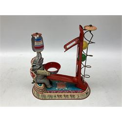 Late 20th century West German clockwork tinplate performing circus elephant ball and helter-skelter toy, after an original by Joseph Wagner, marked JW, with key, H24.5cm