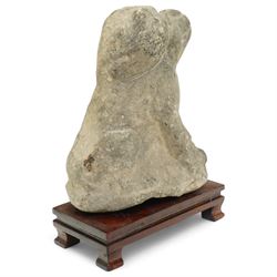 Chinese Western Han Dynasty (206BC–24AD) carved seated stone dog, stylized figure with upright ears and upraised squared snout, grey stone with weathered surface and tool marks visible to underside W13cm H16.5cm