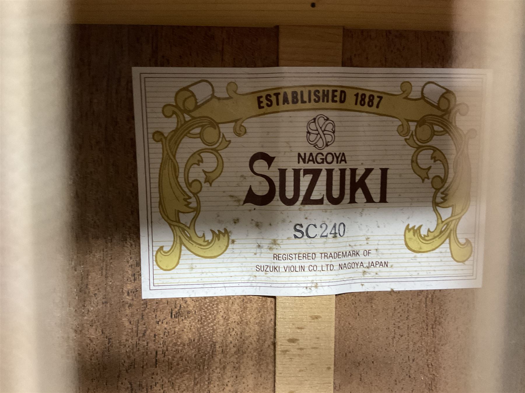 Nagoya Suzuki Model SC240 acoustic guitar with mahogany back and ribs and spruce top, bears label, L101cm; in soft carrying case