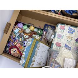 Quantity of crafting materials and accessories predominantly related to sewing, to incliude threads, beads, ribbons etc, some housed in wicker storage baskets