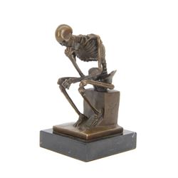Bronze figure of skeleton modelled as The Thinker, on black marble base, signed and with f...