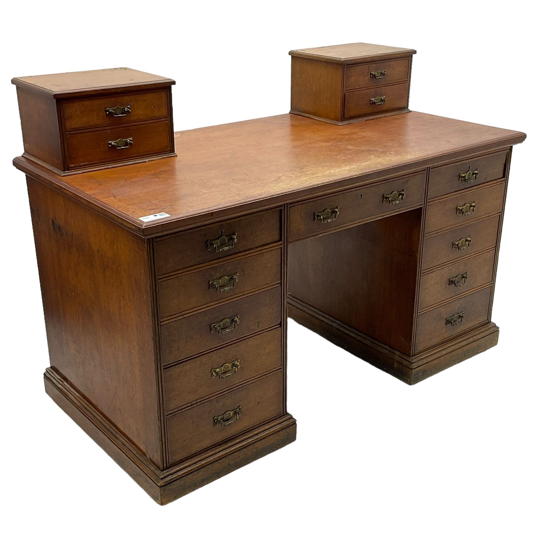 C. Hindley & Sons (London: 1820-1892) - Late Victorian walnut twin pedestal desk, the rectangular moulded top surmounted by two banks of two drawers over eleven graduating drawers, on moulded plinth base, the central drawer stamped 'C. Hindley & Sons, 134 Oxford Street, London, 5298'