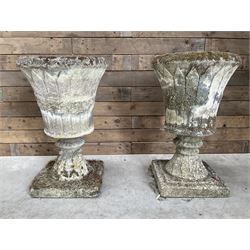 Pair of Regency design weathered cast stone garden urns
