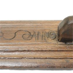 18th century oak mangle board, carved with scrolled motifs, incised 'ANNO 1717', W57cm 