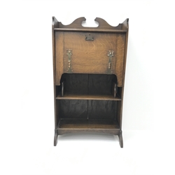 Art Nouveau period oak writing desk with decorative anodised strap hinges, retailed by Denby & Spink Leeds, W65cm, H121cm, D32cm