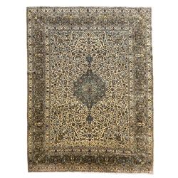 Persian Meshed carpet, ivory ground and decorated with intricate floral design with trailing scrolled branch, the central medallion decorated with stylised plant motifs, seven band border, the main band decorated with scrolls and flower head motifs