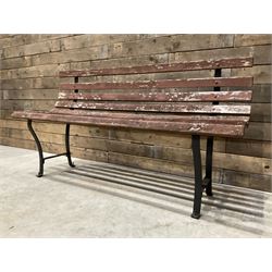 Wrought metal and wood slatted garden bench