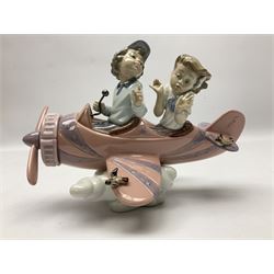 Lladro figure, Don't Look Down, modelled as a girl and boy in a plane, sculpted by Joan Coderch, no 5698, year issued 1990, year retired 2004, H17cm