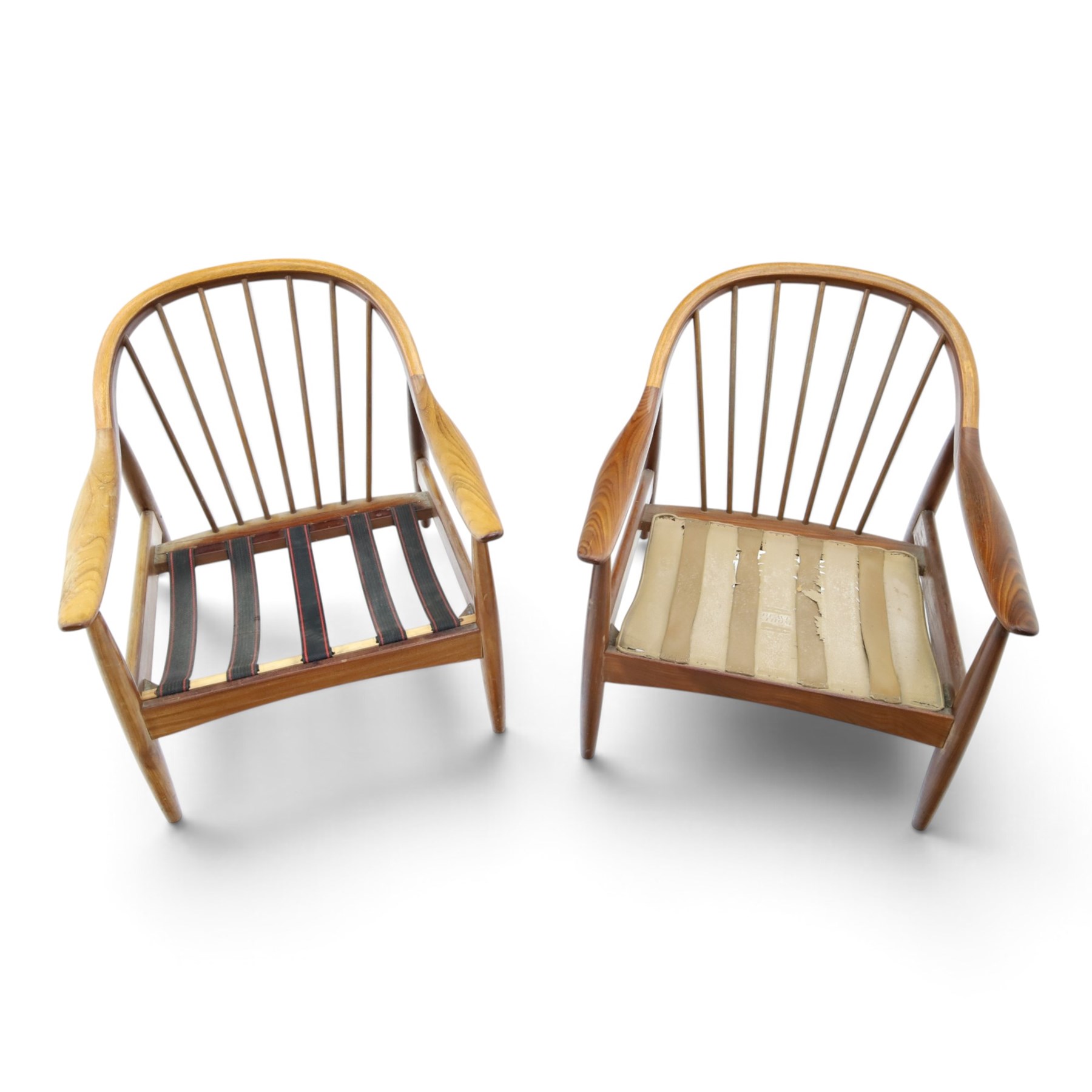 Greaves & Thomas - pair of mid-20th century light elm framed lounge armchairs, with downswept arms and a spindle back, webbing base with makers mark, tan brown leather seat cushions with button back detail
