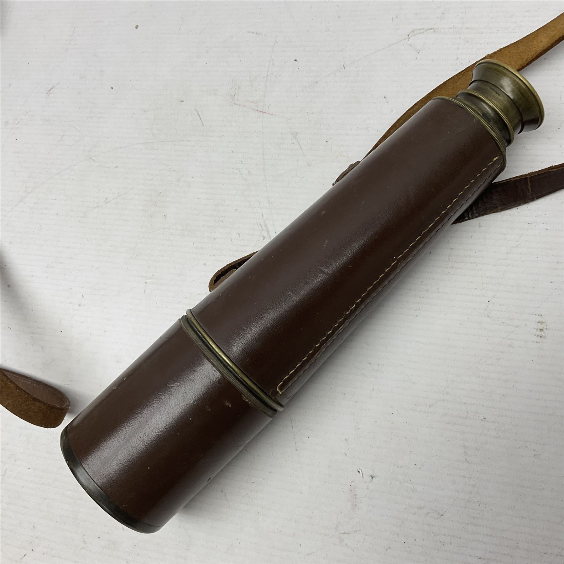 Broadhurst Clarkson brass and leather 4-draw telescope, the first draw with graduations, sliding lens shroud and leather covers for both ends on shoulder strap; marked 'Broadhurst Clarkson & Co. Ltd. 63 Farringdon Road London E.C.', L87cm fully extended; together with a WWI brass marching compass marked F-L No.123113 1918 (broad arrow); crudely etched L.H. McD. Latham; in associated Brooks & Co. leather case dated 1913 stamped W.B. Constable (2)