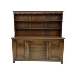 Georgian style oak dresser and rack, fitted with three drawer and two cupboards, two shelves